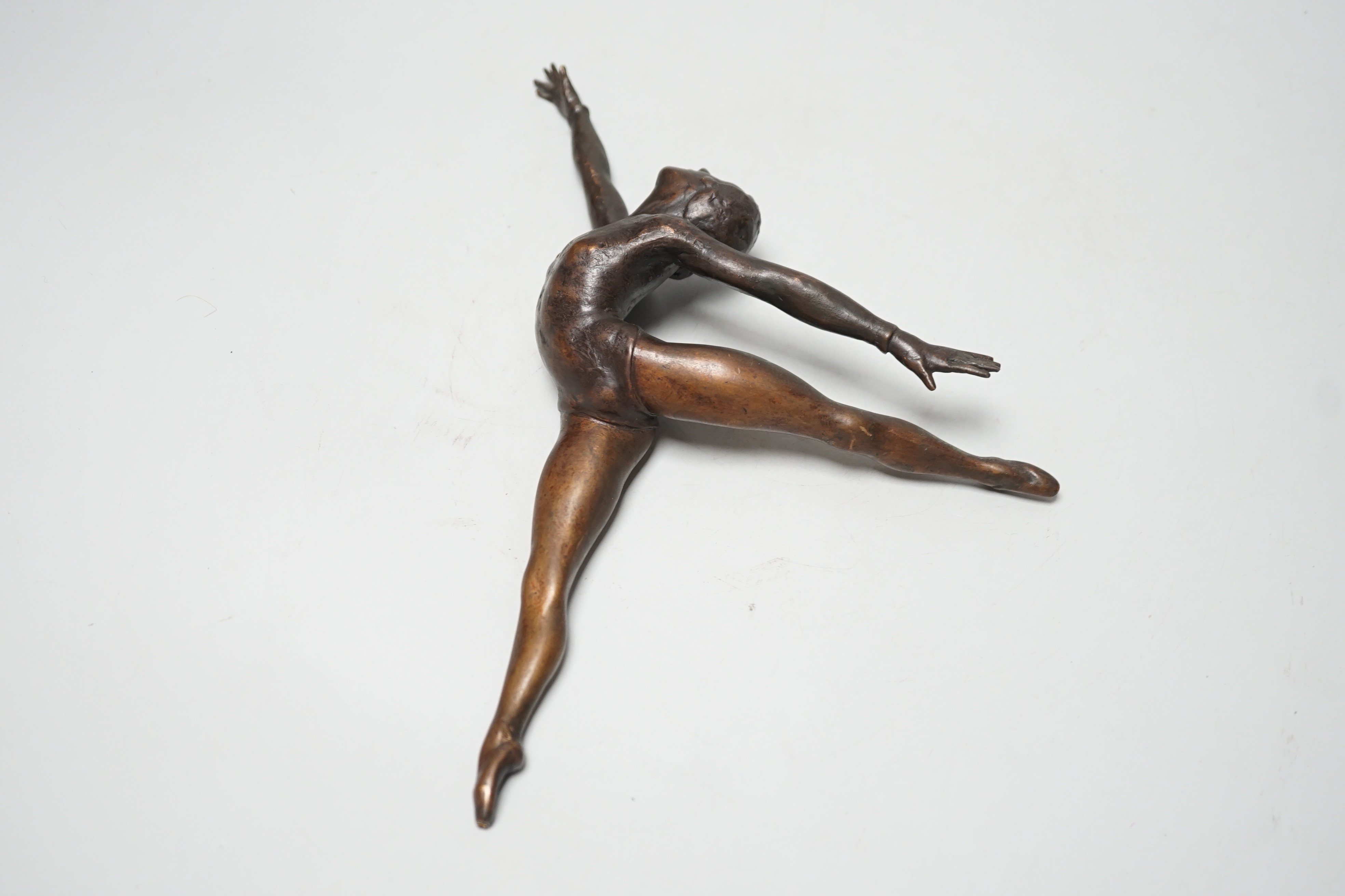A bronze sculpture of a ballerina. 26cm wide